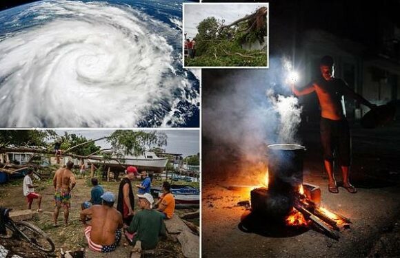 Cubans cook over fiery oil drums after Ian left island without power