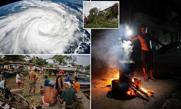 Cubans cook over fiery oil drums after Ian left island without power