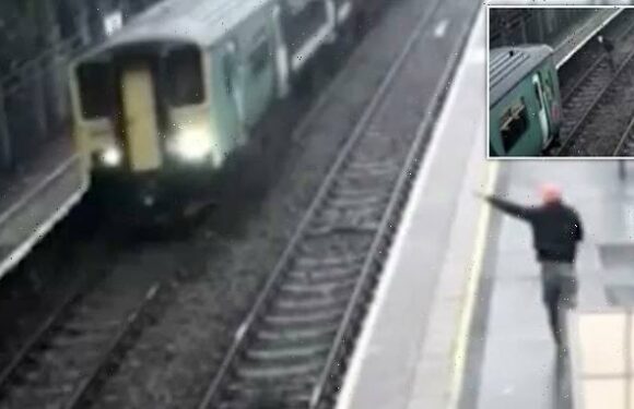 Drunk passenger ran across train tracks before crawling UNDER train
