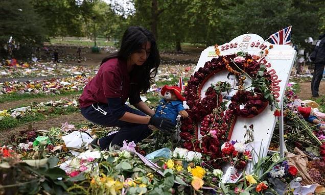 Flowers, cards and Paddington Bears left for the Queen are removed