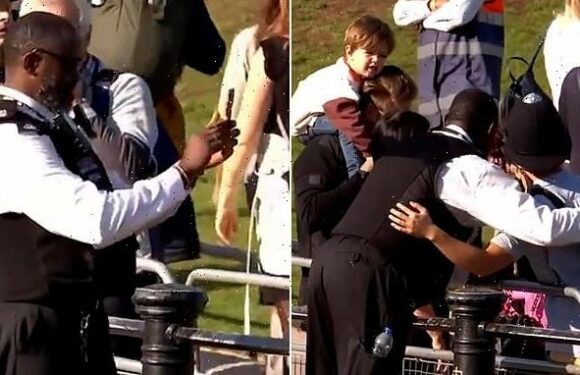 Friendly MET police officer lends his hat to the people