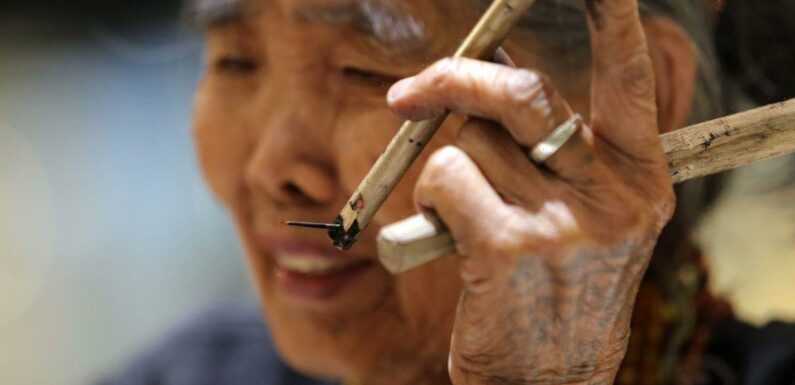 Meet the world’s oldest tattoo artist at 105 – and she’s covered in ink herself