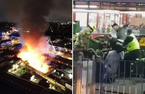 Men brawl and throw FRUIT at each other outside ablaze supermarket
