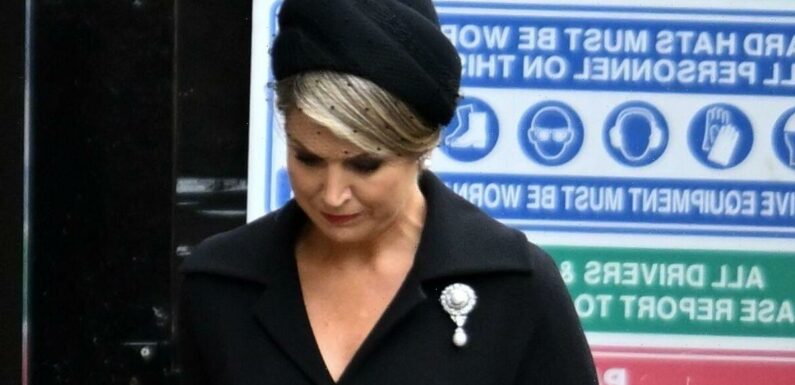 Queen Maxima bows head wearing solemn black hat and veil – pictures