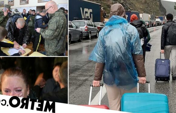 Russians drag suitcases across border to escape Putin's mobilisation order