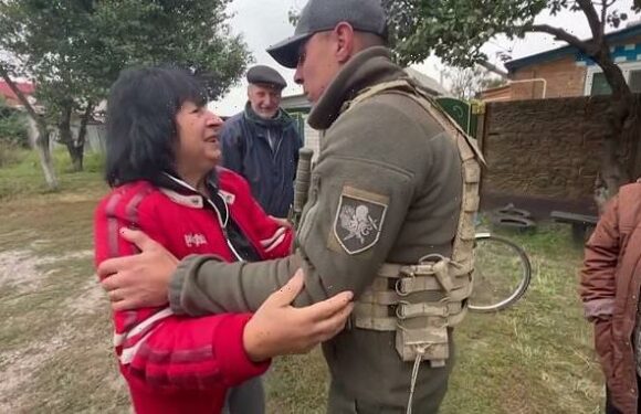 Ukrainian mother weeps as she is reunited with son in liberated town