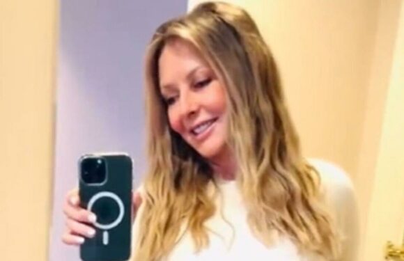 Carol Vorderman squeezes curves into tight leather leggings