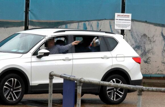 Dover petrol bomb: Moment ‘laughing’ man throws missile at immigration centre before ‘killing himself’ | The Sun