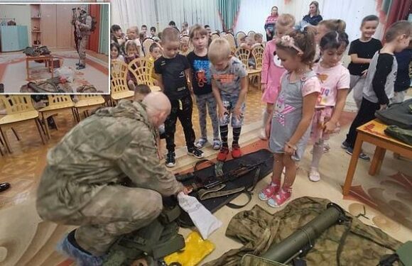 FOUR-year-olds are shown how to use AK-47s and grenade launchers