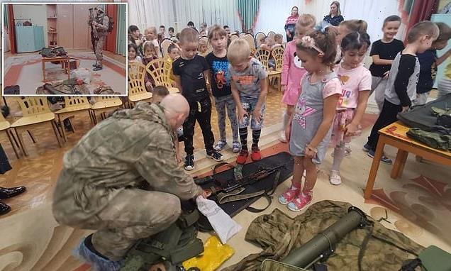 FOUR-year-olds are shown how to use AK-47s and grenade launchers