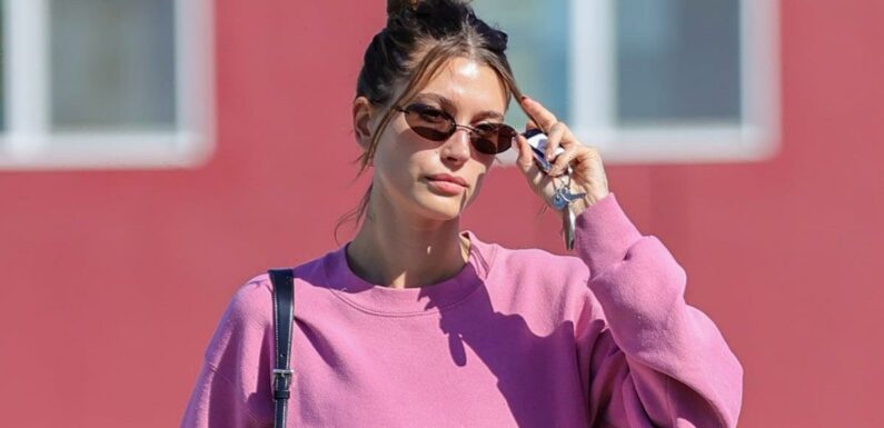 Hailey Bieber Styles Her Cutout Onesie With White Sneakers and a Prada Bag