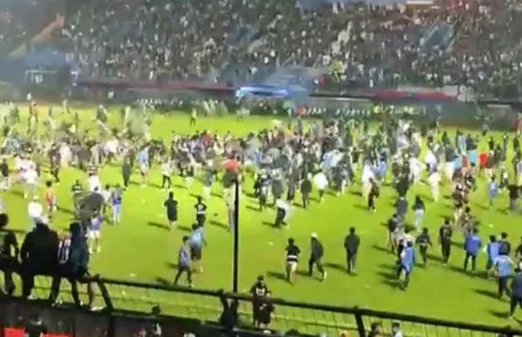 Horror football riots leave at least 127 people dead including children and police officers after fans storm pitch | The Sun