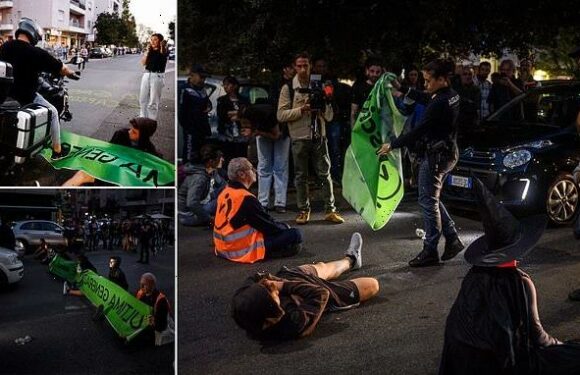 Italian eco-zealots lie in the middle of busy motorway in Rome