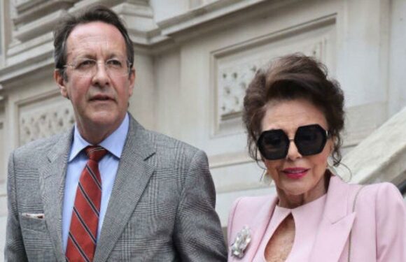 Joan Collins looks ageless in pink outfit out on the town with Percy