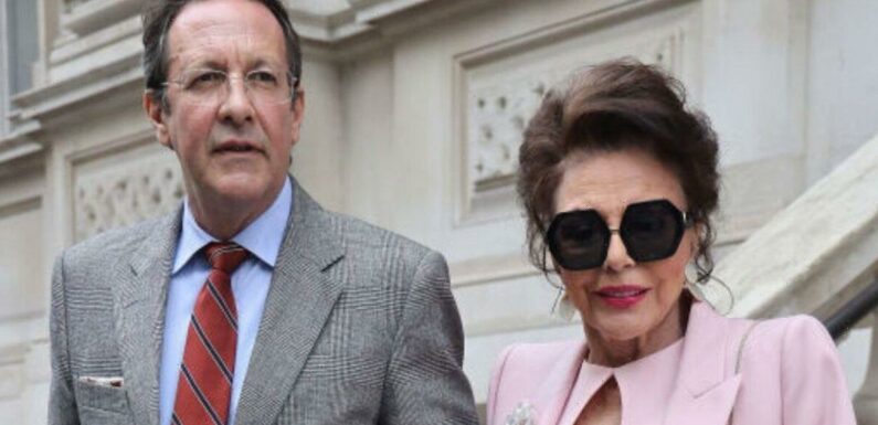 Joan Collins looks ageless in pink outfit out on the town with Percy