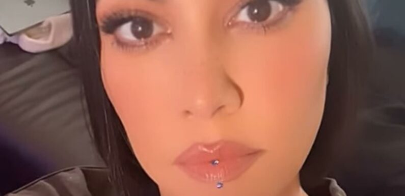 Kourtney Kardashian shows off new face piercing in shocking video after fans ripped star for 'losing her identity' | The Sun