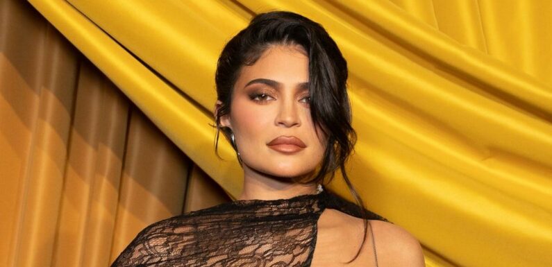 Kylie Jenner Hangs Poolside in a Chic Black Thongkini With Her Baby Son
