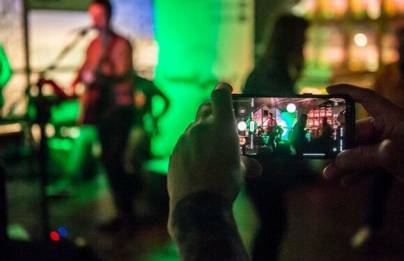 Music-lovers have "charge anxiety" at gigs – as they rely on their phones