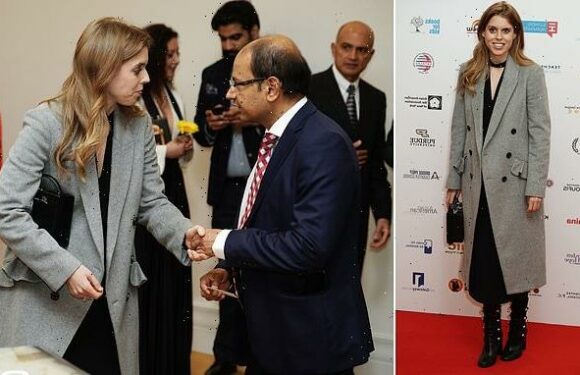 Princess Beatrice looks chic in a grey coat and leather boots