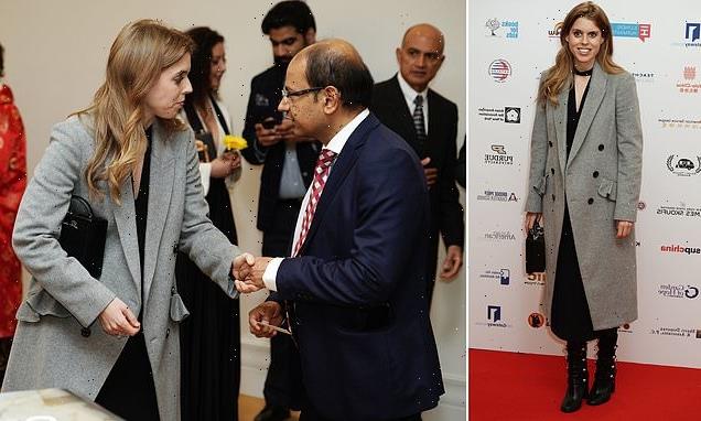 Princess Beatrice looks chic in a grey coat and leather boots