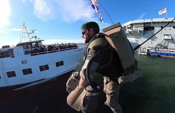 Royal Navy servicemen board HMS Queen Elizabeth with jet packs