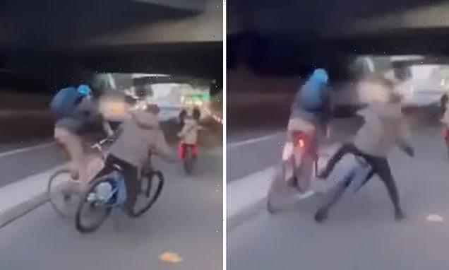 Shocking moment London cyclist tries to shove wheelie rider