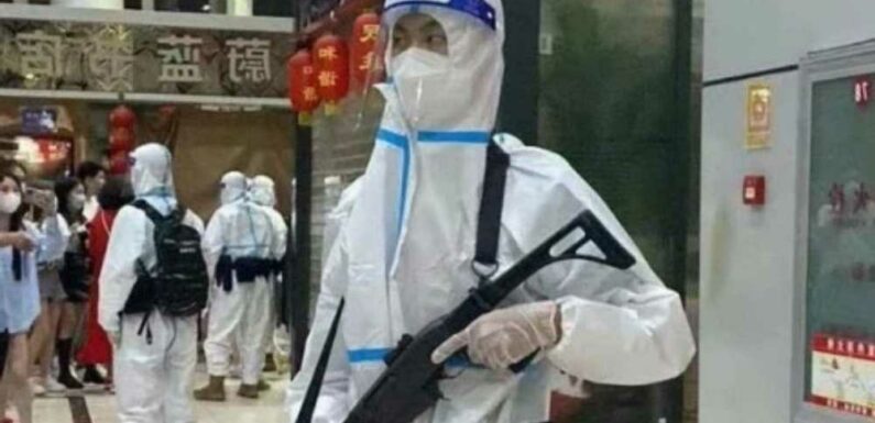 Shocking moment machine gun cops herd terrified families to quarantine camp in disturbing vision of ‘Covid zero’ China | The Sun
