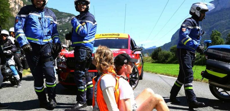 Tour de France Halted After Protesters Block Road, Light Flares