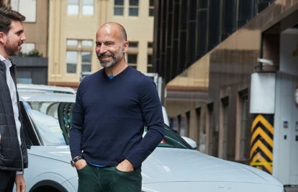 Uber rolls out electric vehicles but won’t budge on hourly pay