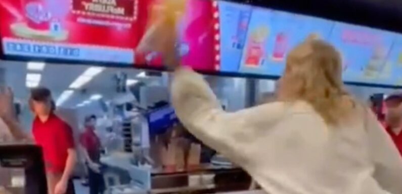Watch as McDonald's customer goes on a rampage and SPITS at horrified staff and throws drink in their face | The Sun