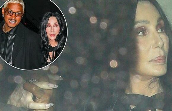 Cher arrives at home holding hands with rumored beau Alexander Edwards