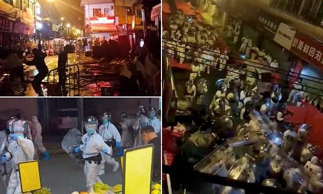 China protests: Protesters clash with hazmat-clad Covid-enforcers