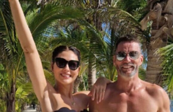 Emma Willis flaunts her gym-honed figure in tiny black bikini