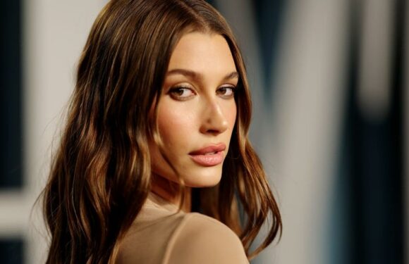 Hailey Bieber Goes Full Vampire For Halloween in Fangs and Versace Harness Bra