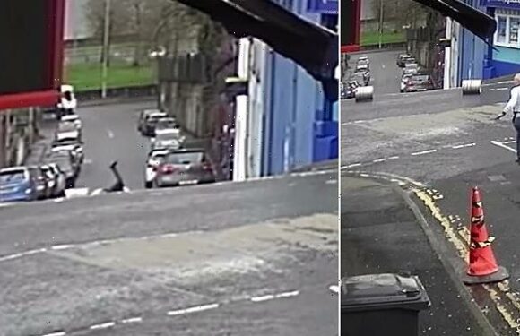 Hilarious moment pub owner chases pair of runaway beer kegs down hill