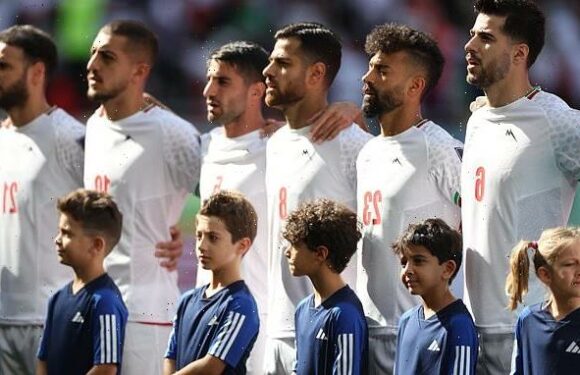 Iranian players SING their national anthem ahead of Wales game