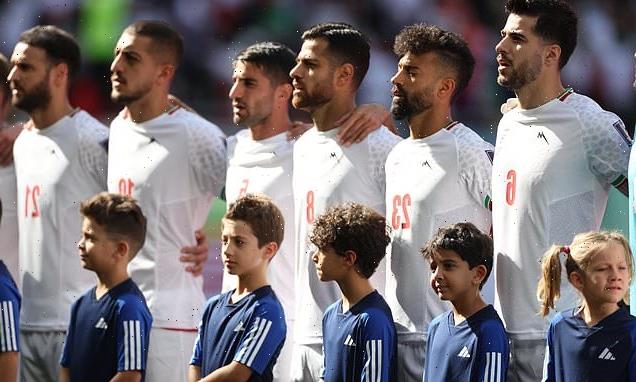 Iranian players SING their national anthem ahead of Wales game