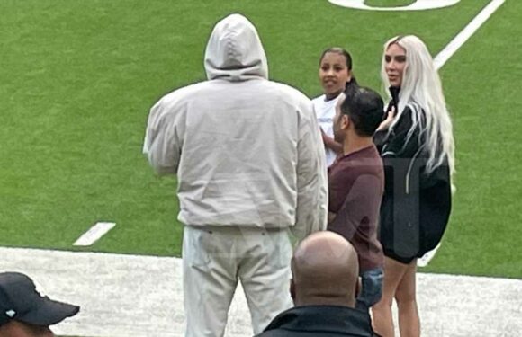Kim Kardashian and Kanye West Attend Saint's Football Game, Chat on Sidelines