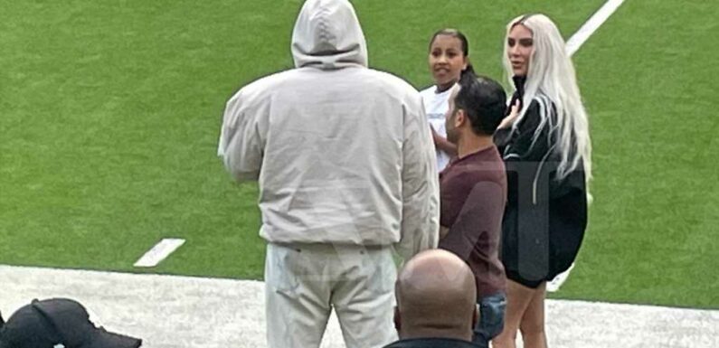 Kim Kardashian and Kanye West Attend Saint's Football Game, Chat on Sidelines