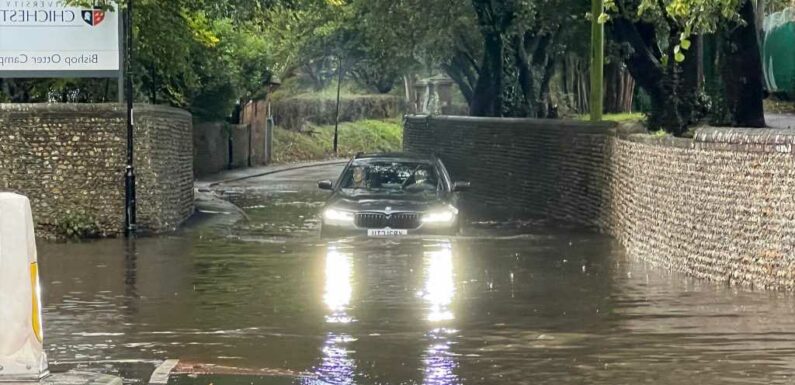 UK weather – Brits hit with rain warnings and flood chaos on roads after showers lash down | The Sun