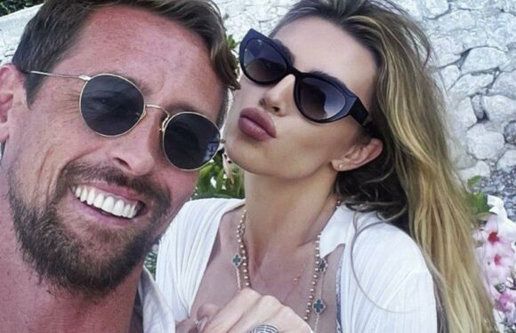 Abbey Clancy shows off toned figure and flashes peachy derrière in tiny bikini