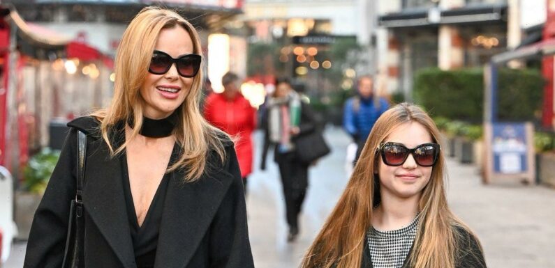 Amanda Holden is twinning with daughter Hollie, 10, as they wear matching coats and sunglasses