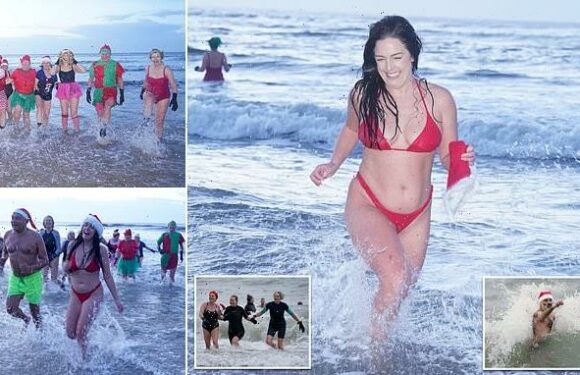 Brave festive swimmers strip off for a festive dip on balmy 9C morning