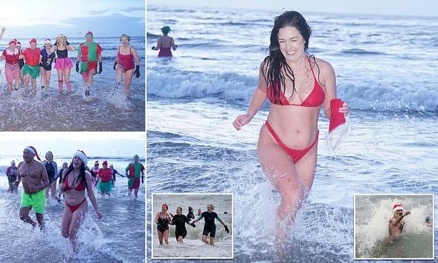 Brave festive swimmers strip off for a festive dip on balmy 9C morning