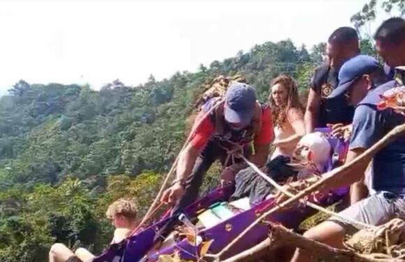 Brit tourist plummets 130ft from waterfall in Thailand & 'shatters his hip' in terrifying accident on holiday with pals | The Sun