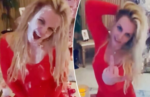 Britney Spears flips off camera, eats cake from floor after Instagram return