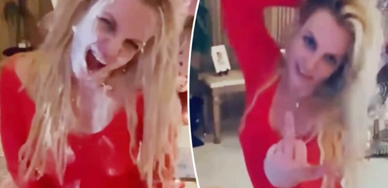 Britney Spears flips off camera, eats cake from floor after Instagram return