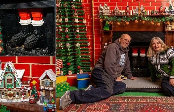 Couple build 12ft Lego Christmas wall complete with fireplace and tree