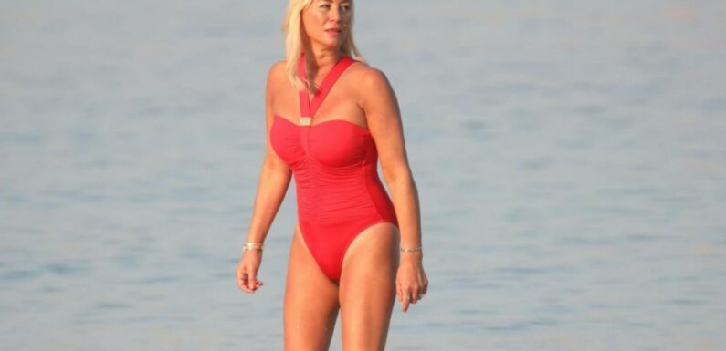 Denise Van Outen looks incredible in red swimsuit as she soaks up the sun in Dubai | The Sun