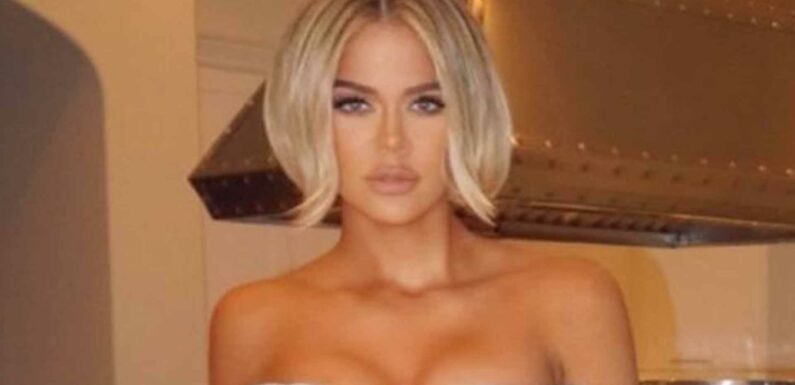 Khloe Kardashian makes fans go wild in white bodycon dress with slit all the way up to her hip bone in new sultry snap | The Sun